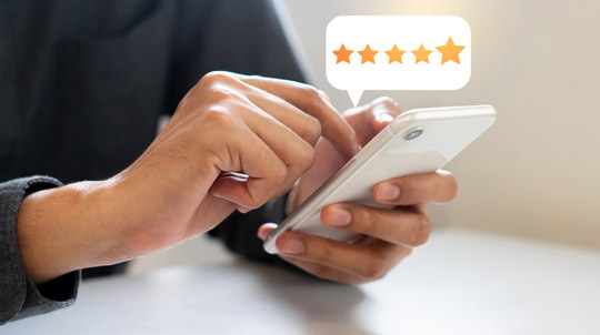 Person reviewing on cellphone Reviews-540